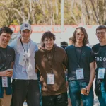 A group of young guys hanging out in the Plaza at KEC 2024 (thumbnail)