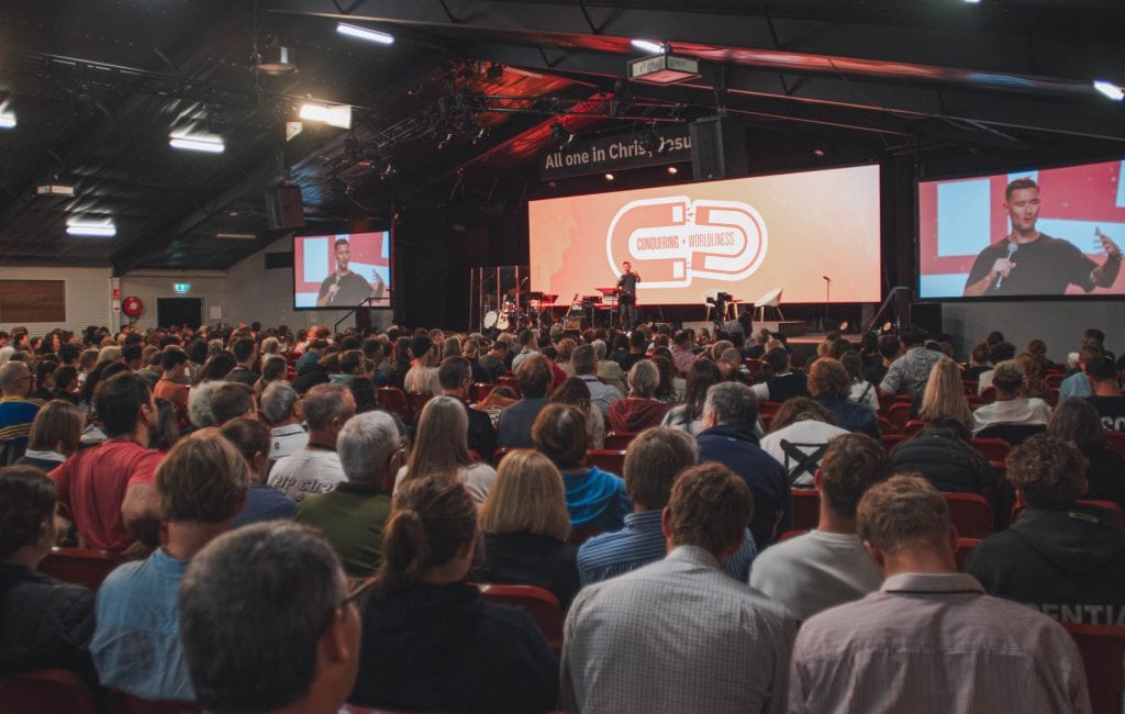 Large audience attending Katoomba Easter Convention event in a spacious hall.