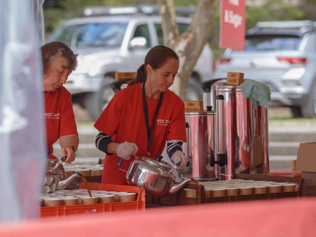 Volunteers serving food at Katoomba Easter Convention event.